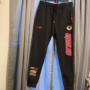 DREAMLAND Black Joggers with Red 
Accents and Graphic Side Pattern 
SIZE Large